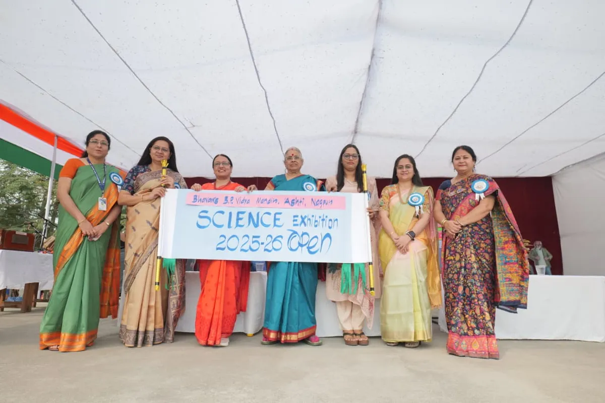 Women under a tent holding a banner for the science exhibition at Bhavan's BVM Ashti