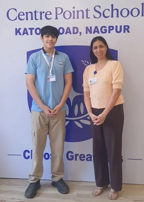 Student in light blue uniform and woman in peach top at CPS (Katol Road)