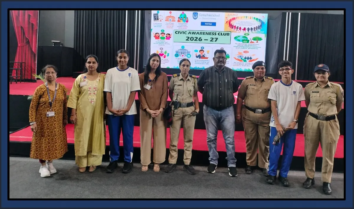 Group photo of nine people, including students, teachers and uniformed police officers, standing on a stage in front of a screen with a Civic Awareness Club slide.