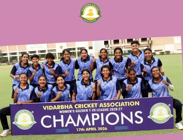 Group photo of women cricketers in blue jerseys with a champions banner at CPS (Katol Road)