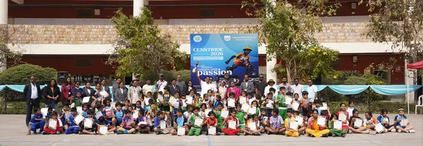 Large outdoor group photo of many children holding certificates, with adults standing behind them and a banner for CENSTRIDE 2026 at CPS (Wardhaman Nagar).