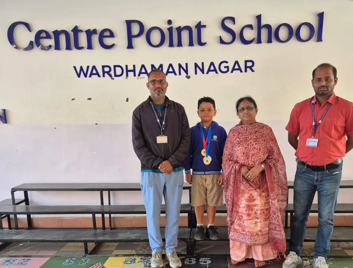 Rudra Gode from CPS (Wardhaman Nagar) with coaches Khushal Balbudhe, Rashmi Bais, and Roshan Choudhary at the Inter-School Swimming Competition