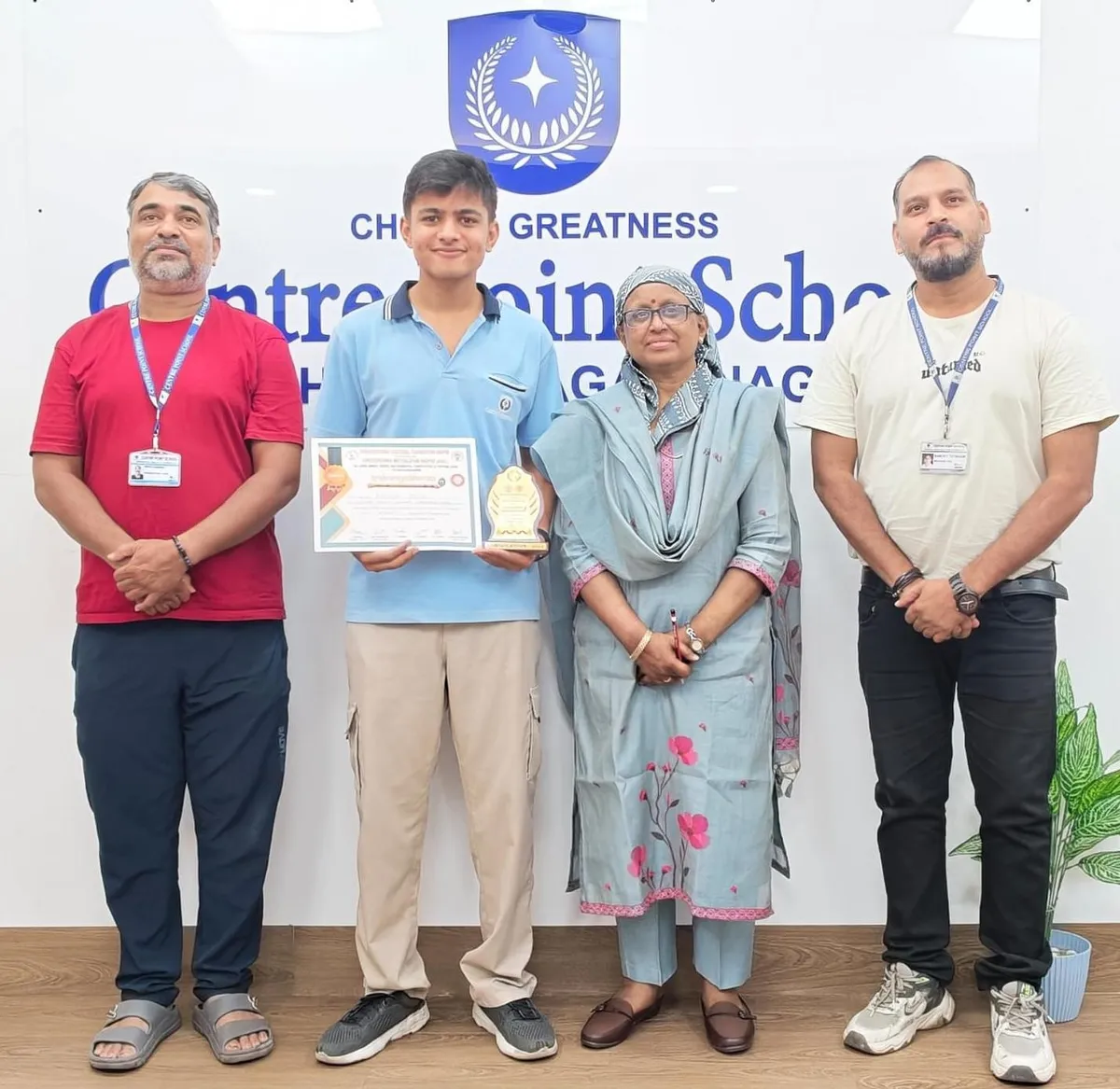 Kavish Jain holding certificate and trophy at CPS (Wardhaman Nagar)