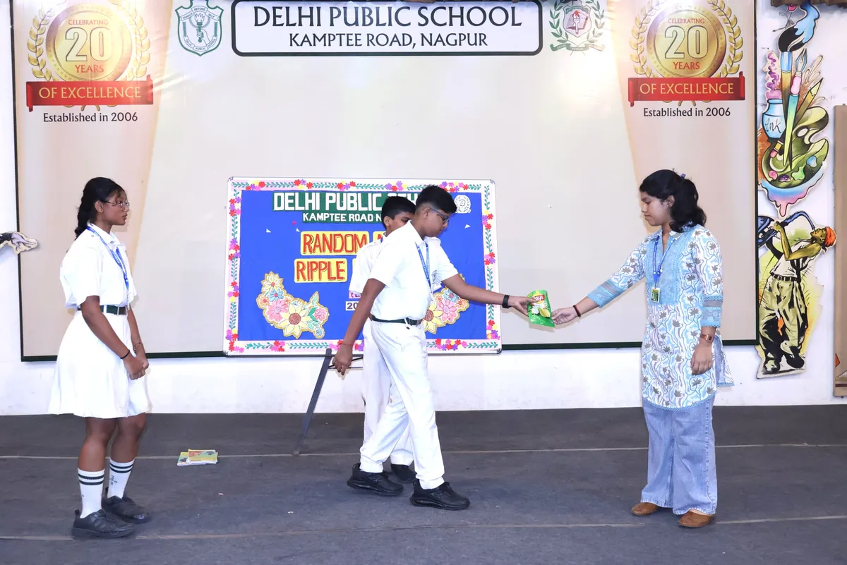 Students in school uniform performing a skit on a stage at DPS (Kamptee Road)