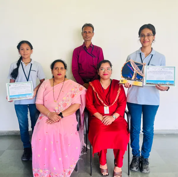 Sandipani (Hazaripahad) students with mentors and school staff displaying certificate and trophy